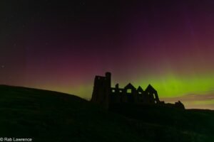 Aurora over Slains Castle