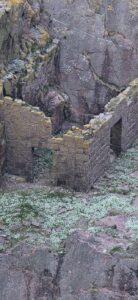 Collapsed quarry bothy at Longhaven Cliffs