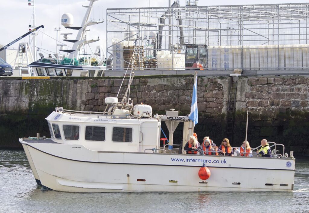 Some SeaFest Peterhead visitors out on InterMaras organised tours. Credit Fat Man Skinny Camera